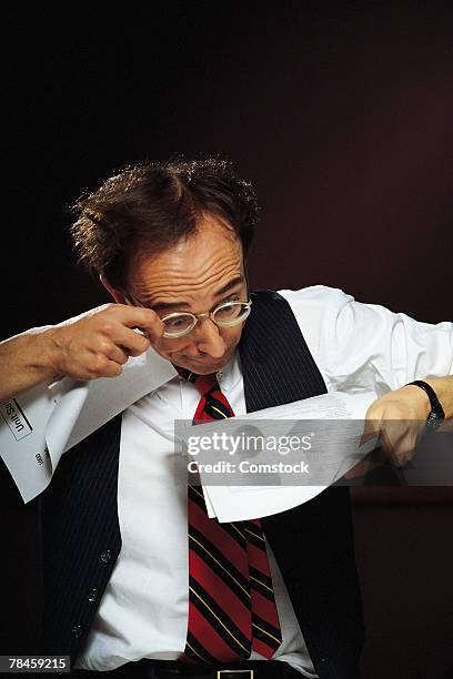 businessman reading fine print - reading the fine print stock pictures, royalty-free photos & images