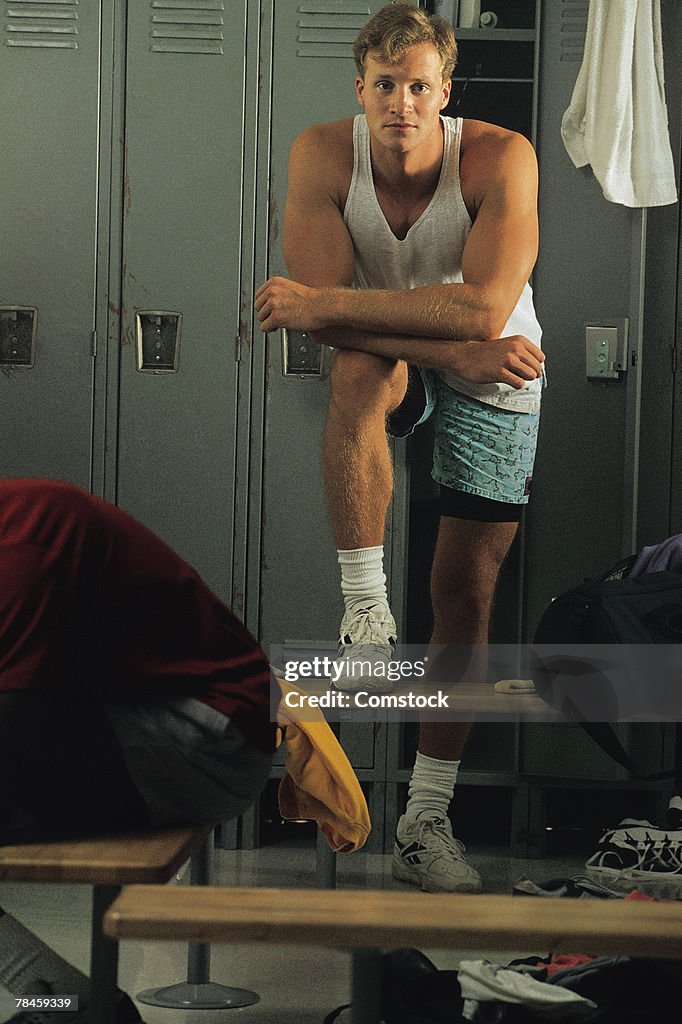 Man posing in locker room