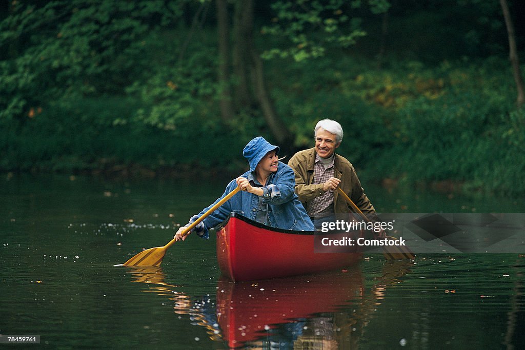 Retired couple canoeing