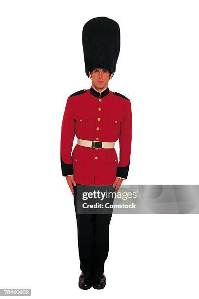 man in uniform of british royal guard - queens guard stock pictures, royalty-free photos & images