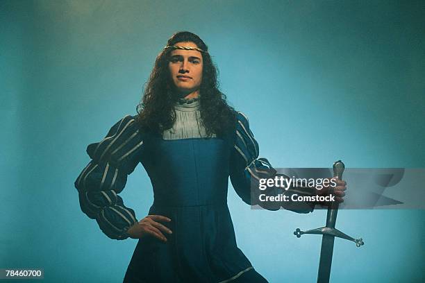 prince posing confidently with sword - prince charming stock-fotos und bilder