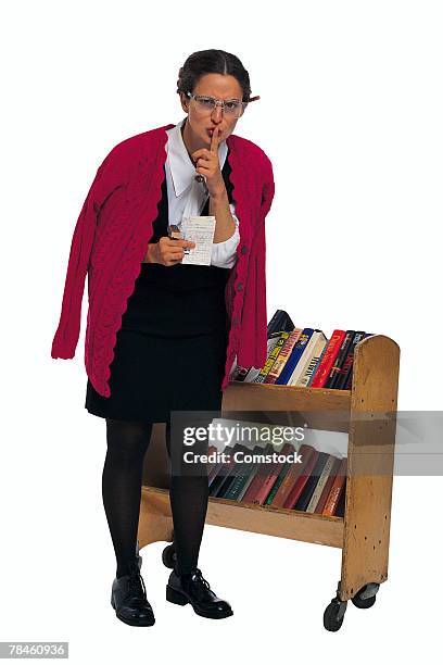 librarian gesturing for quiet - librarian stock pictures, royalty-free photos & images