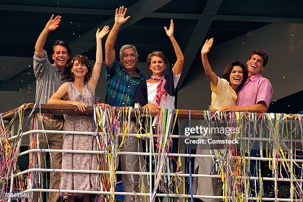 couples waving from deck of cruise ship - bon voyage stock pictures, royalty-free photos & images
