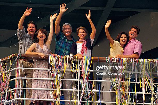 couples waving from deck of cruise ship - bon voyage imagens e fotografias de stock