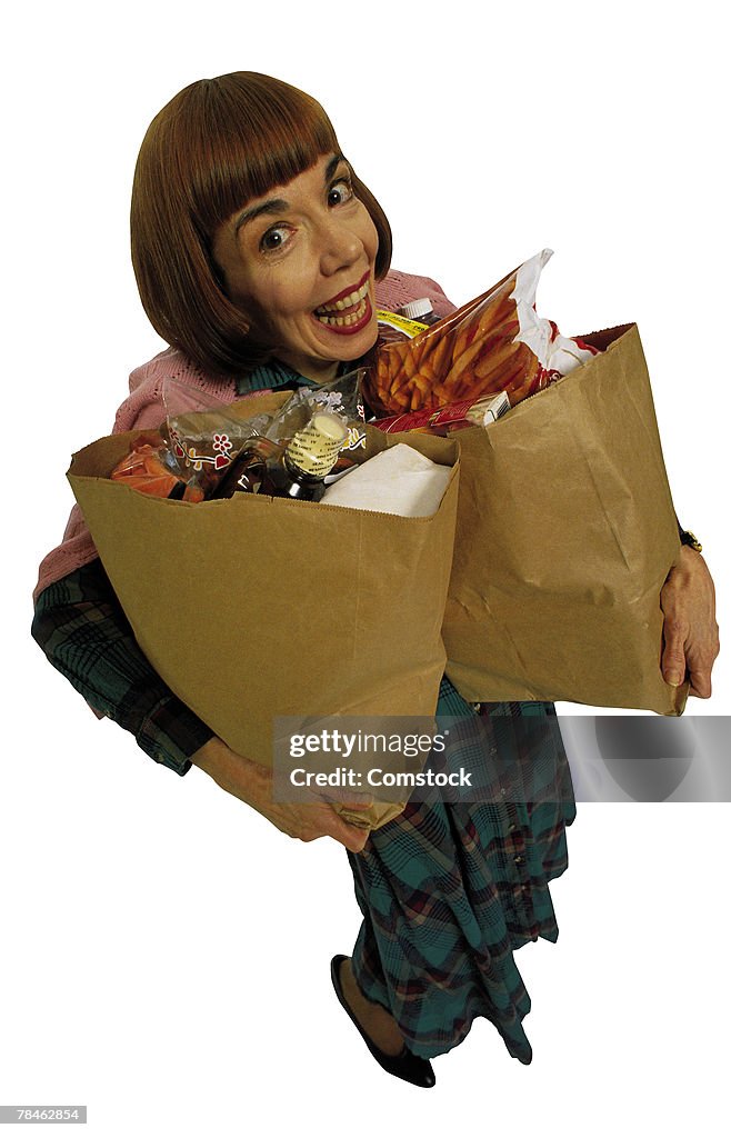 Woman carrying grocery bags