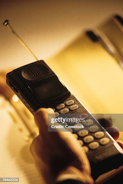 man holding cell phone - 90s cell phone bildbanksfoton och bilder