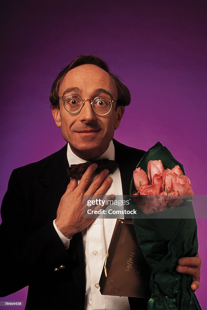 Man in tuxedo with flowers on date