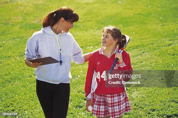 field hockey player and coach - hockey coach stock pictures, royalty-free photos & images