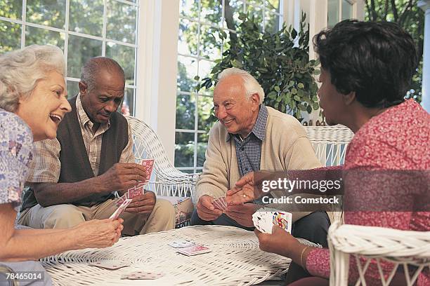 couples playing cards - retirement card stock pictures, royalty-free photos & images