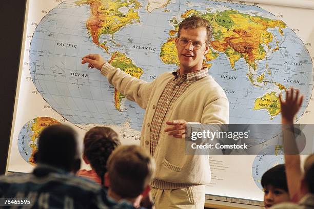 teacher teaching with map of the world - physical geography fotografías e imágenes de stock