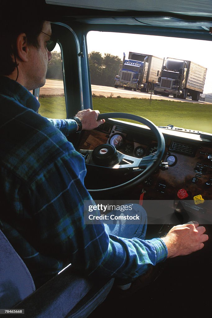 Interior view of man driving big rig