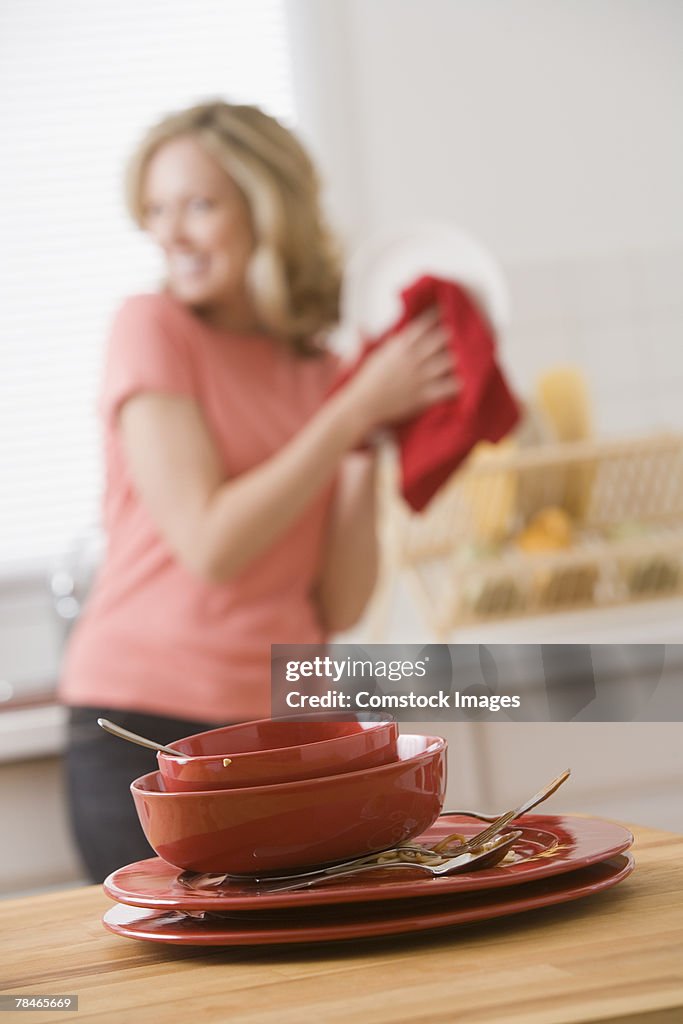 Woman washing dirty dishes