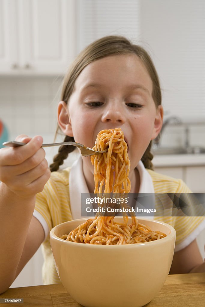 Girl eating spaghetti