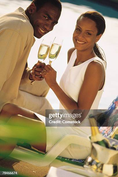 couple toasting champagne - champange bottle and valentines day stock pictures, royalty-free photos & images