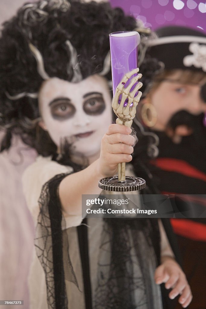 Girl in costume with Halloween goblet