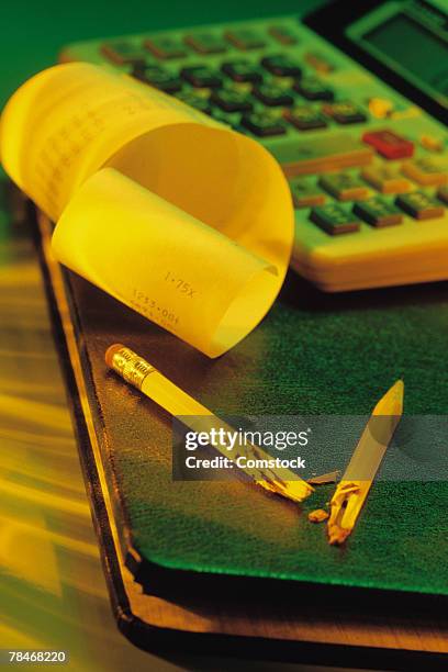 electronic calculator with printout and broken pencil - broken calculator stock pictures, royalty-free photos & images