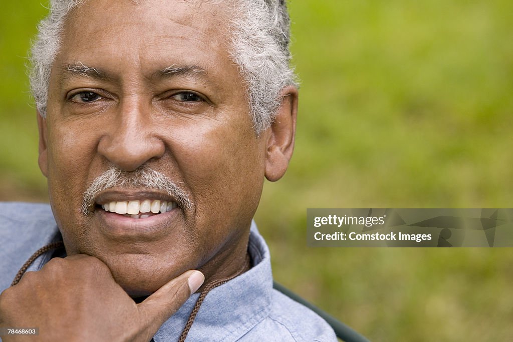 Man resting chin on hand