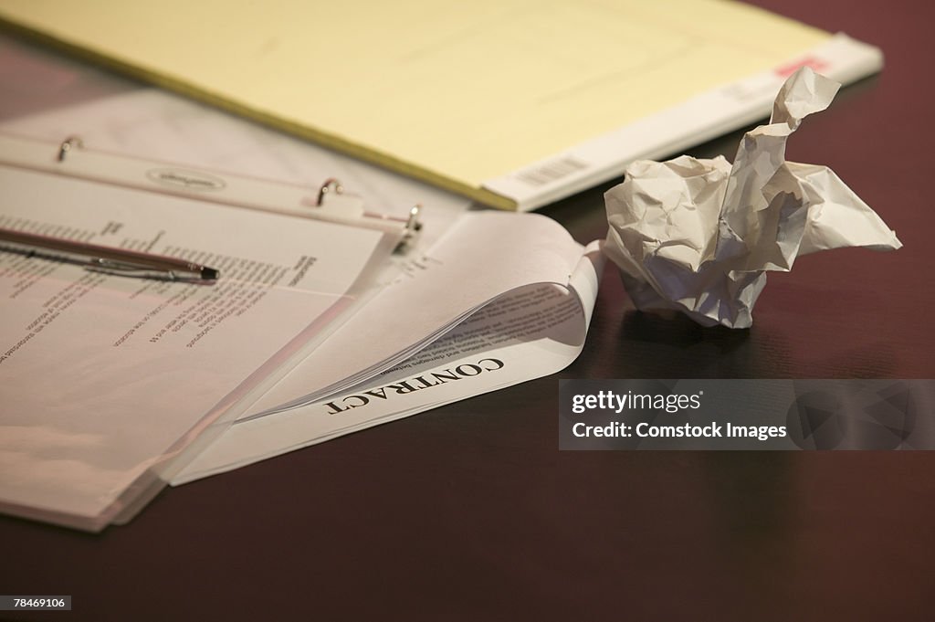 Contract and paperwork on desk