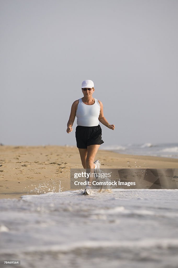 Woman jogging on beach