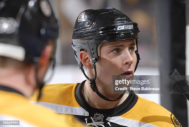 Marc Savard of the Boston Bruins listens to Head Coach Claude Julien's orders against the New Jersey Devils at the TD Banknorth Garden on December...