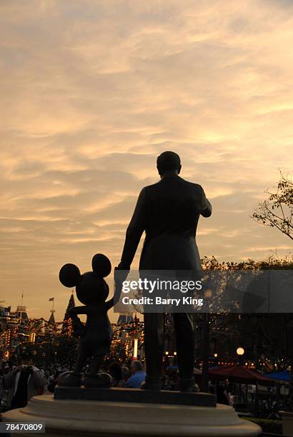 Statue of Mickey Mouse and Walt Disney at Disneyland's Sleeping Beauty's Holiday Castle and "Believe In Holiday Magic" Fireworks spectacular held at...