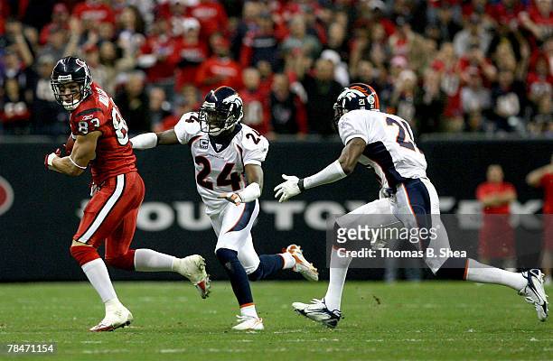 Kevin Walter of the Houston Texans avoids a tackle from Champ Bailey of the Denver Broncos at Reliant Stadium on December 13, 2007 in Houston, Texas.