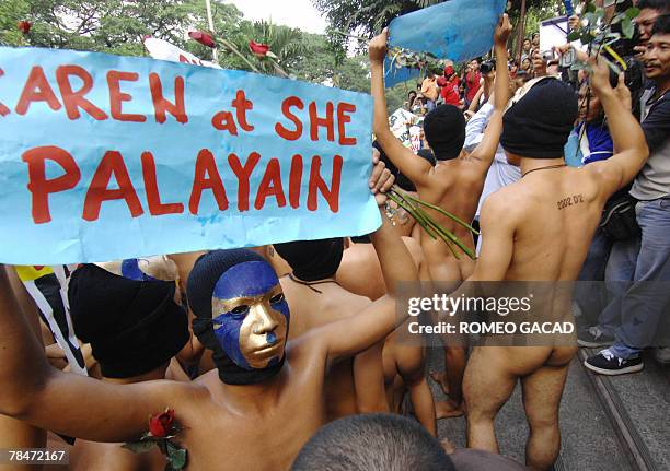 Nude members of the Alpha Phi Omega fraternity parade during their traditional "oblation run" at the University of the Philippines campus in Quezon...