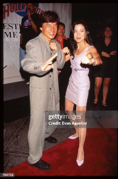 Actors Jackie Chan and Michelle Yeoh stand at the premiere of "Supercop" July 24, 1996 in New York City. The movie was the follow-up to "Rumble in...