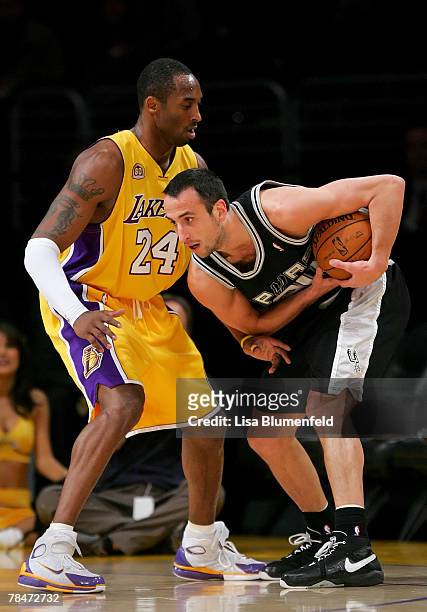 Kobe Bryant of the Los Angeles Lakers puts the pressure on Manu Ginobili of the San Antonio Spurs at Staples Center on December 13, 2007 in Los...