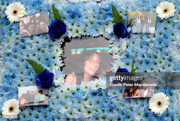 Floral tribute with photographs of Meredith Kercher is shown at her funeral on December 14, 2007 at Croydon Parish Church, South London. Three people...