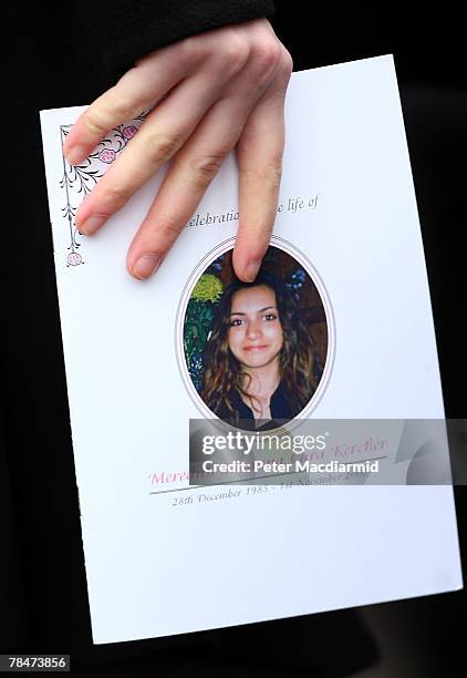Mourner holds an order of service booklet at the funeral of Meredith Kercher on December 14, 2007 at Croydon Parish Church, South London. Three...
