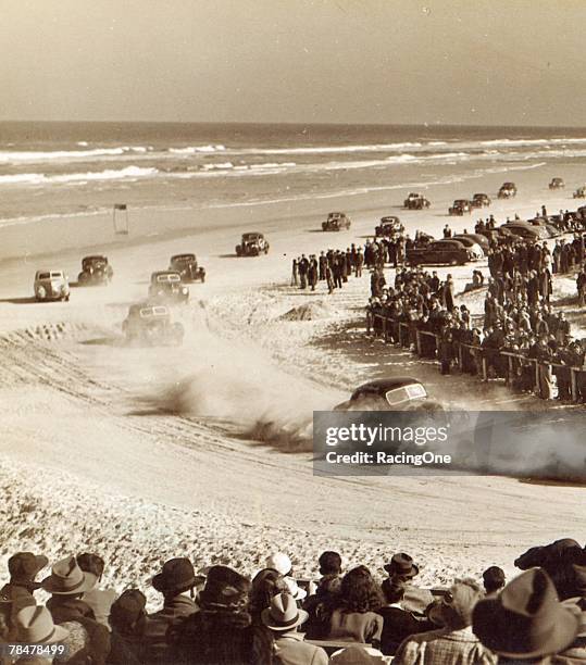 Stock car racing was gaining in popularity before World War II shut down nearly all forms of racing. Here Bill France, Sr., leads the pack around the...