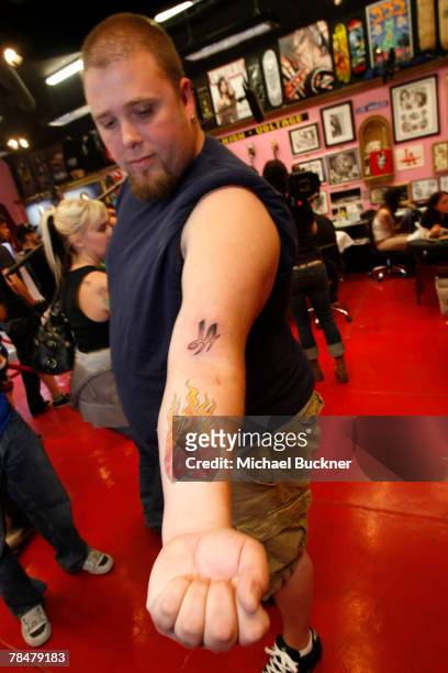Tattoo recipient displays a tattoo at LA Ink December 14, 2007 in West Hollywood, California. Kat Von D is attempting to break the 24-hour Guinness...
