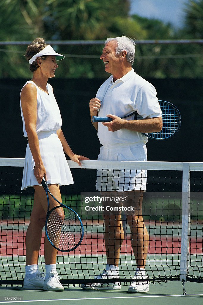 Couple playing tennis