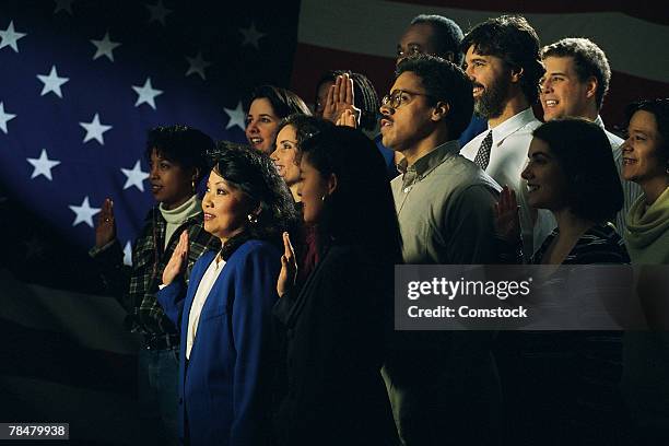 diverse group of people pledging allegiance - amerikanischer treueschwur stock-fotos und bilder