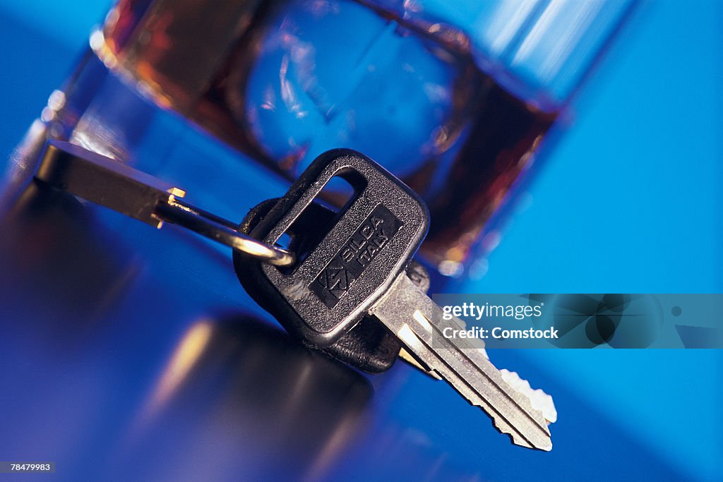 Car keys next to alcoholic beverage