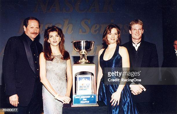 Dale Earnhardt, Jr., and his proud father, Dale, Sr., pose for photos after Junior received the NASCAR Busch Series Championship Cup in New York, New...