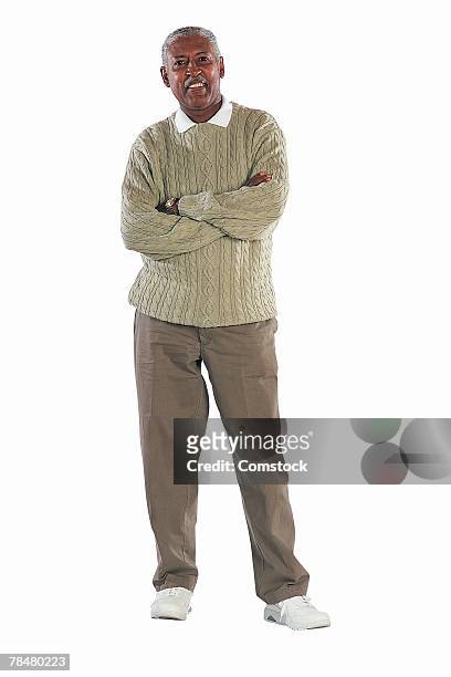 man with crossed arms - old person on white background stockfoto's en -beelden