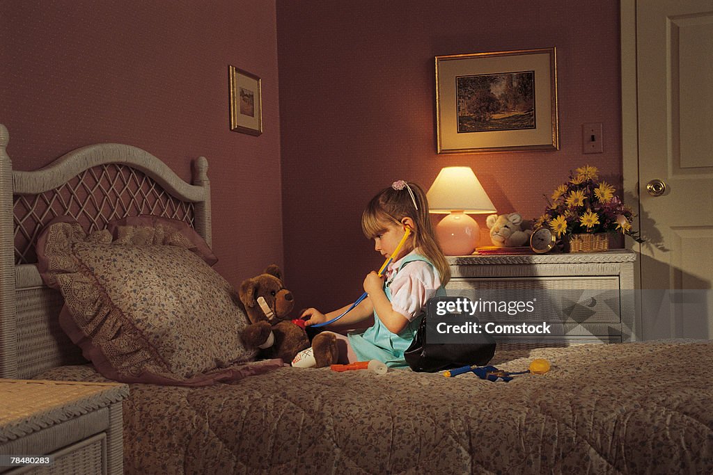 Young girl playing doctor