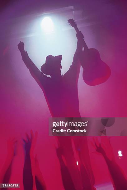 country musician on stage at concert - country and western music stock-fotos und bilder