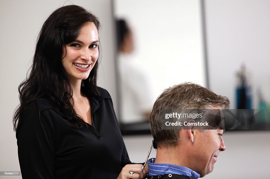 Beautician giving hair cut