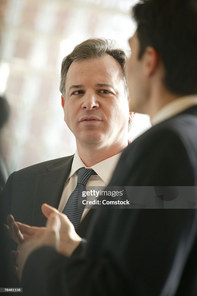 Businessman listening to colleague