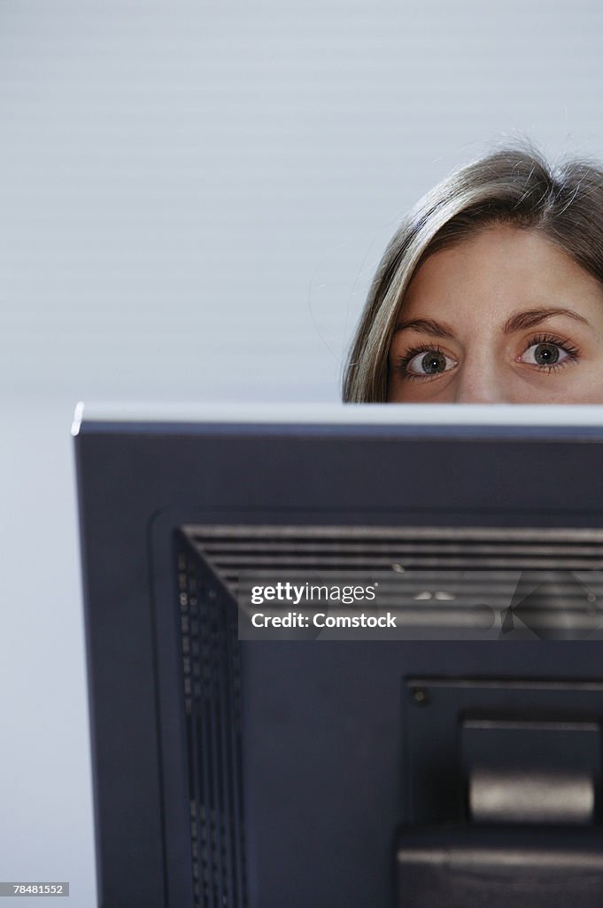 Woman Head Over Computer Screen Woman Peering Over Computer Monitor High-Res Stock Photo - Getty Images