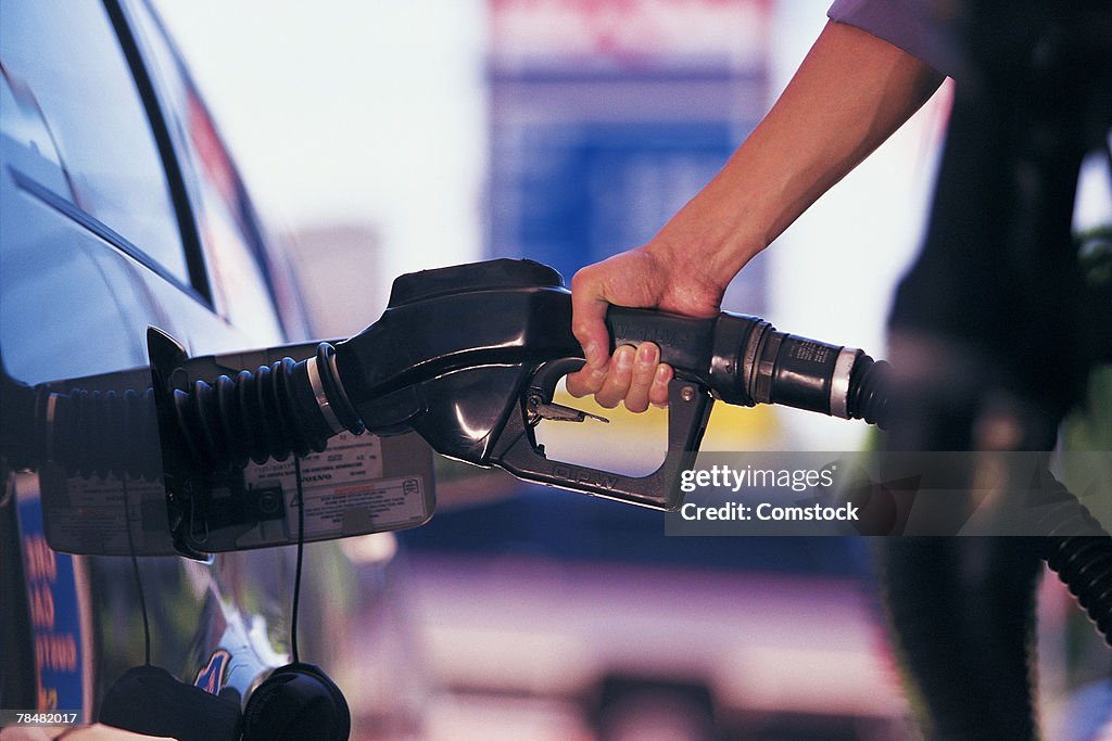 Man pumping gasoline