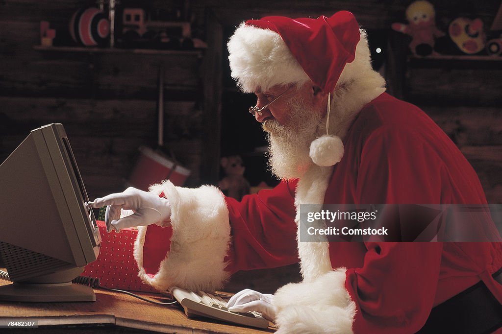 Santa Claus Using Computer High-Res Stock Photo - Getty Images