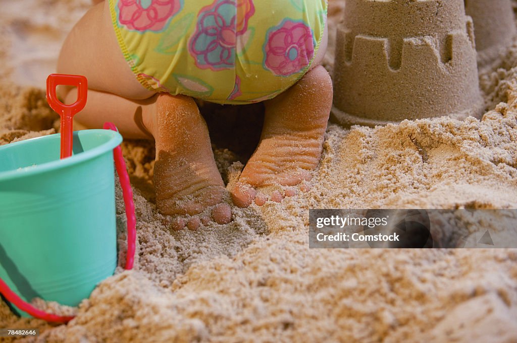 Girl playing in sand