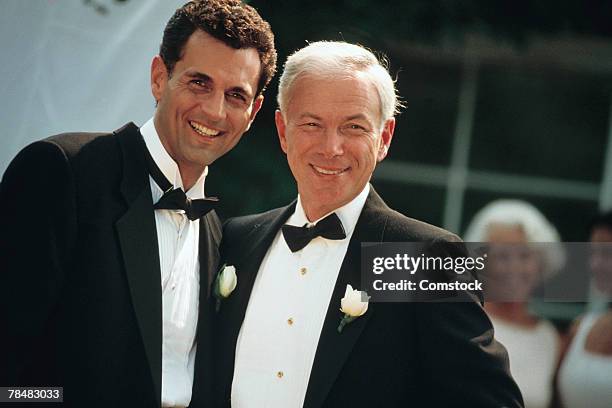 groom and father posing at wedding - dinner jacket stock pictures, royalty-free photos & images