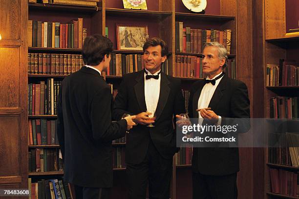 men drinking at formal party - tuxedo party stock pictures, royalty-free photos & images