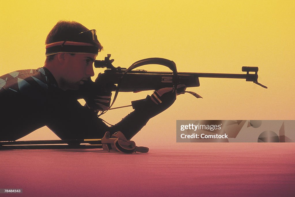 Man aiming a rifle