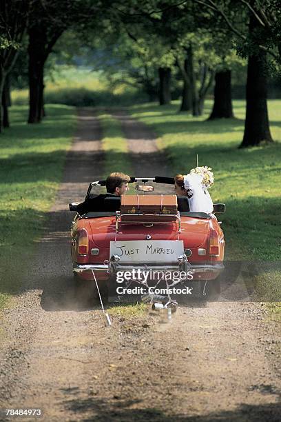 just married and leaving for honeymoon - just married car stock pictures, royalty-free photos & images